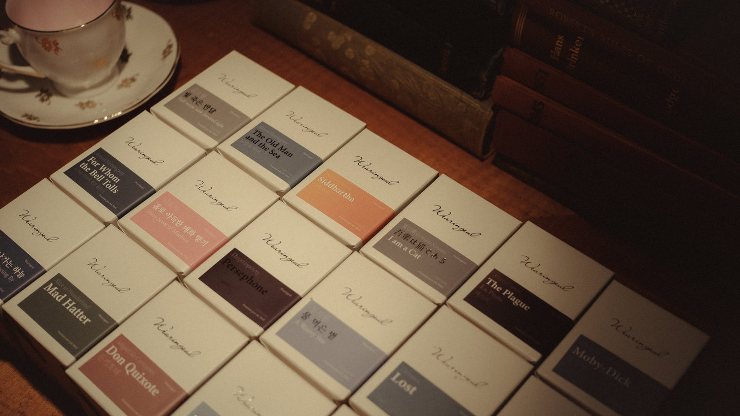 fountain pen ink bottles arranged on wooden desk