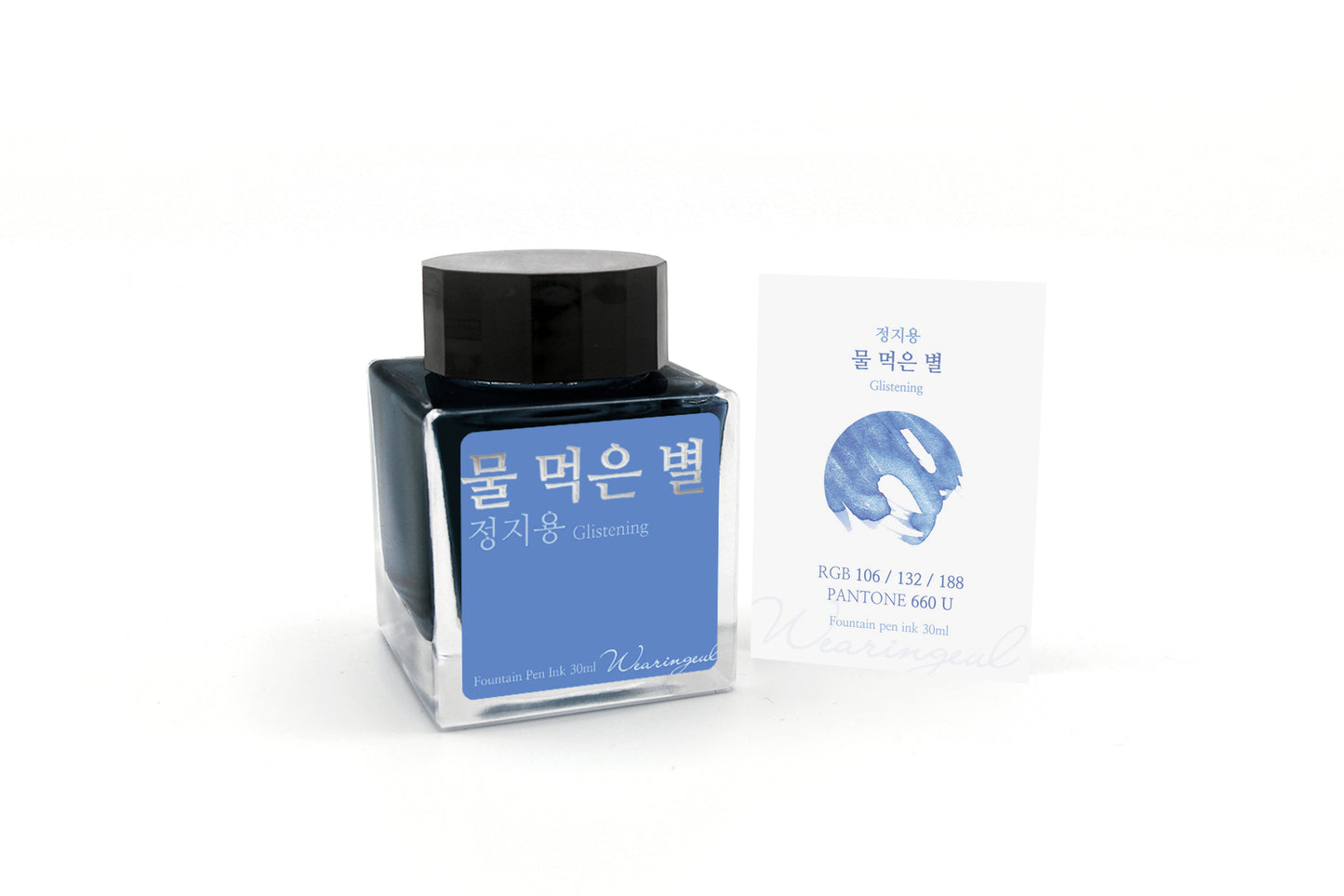 Blue ink bottle with packaging on a white background